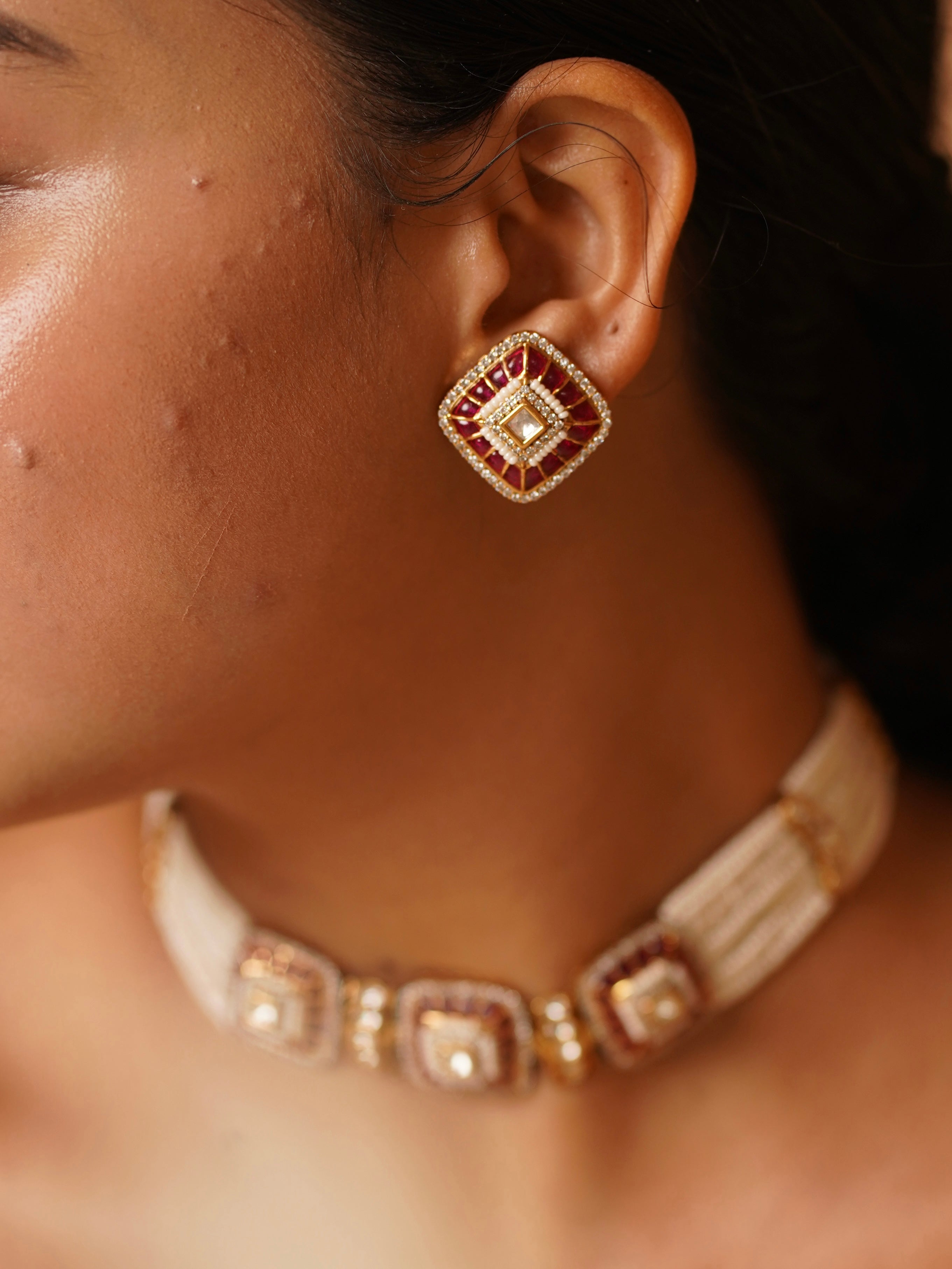 Angled view of pearl choker showcasing polki stones and detailed enamel craftsmanship